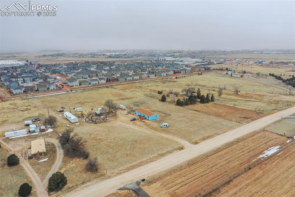 Image 6 of 20: Aerial view of property and surrounding area