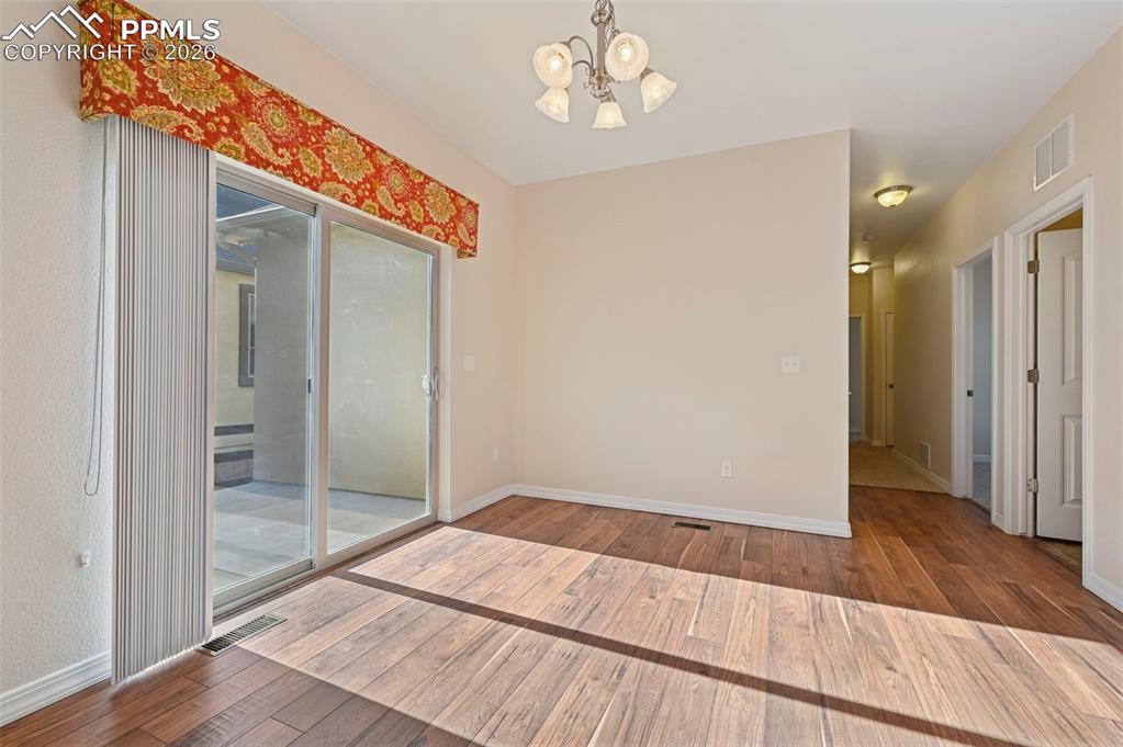 Image 11 of 41: Dining Area with walk-out to patio area