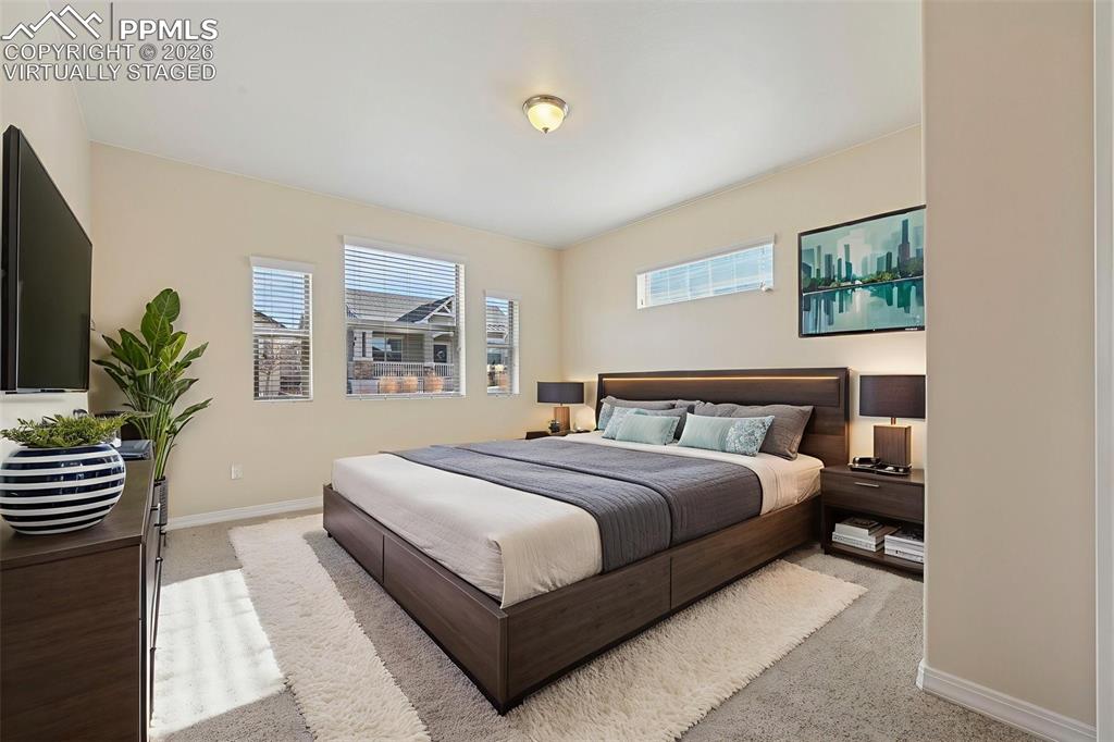 Image 18 of 41: Virtually staged primary bedroom for concept only.