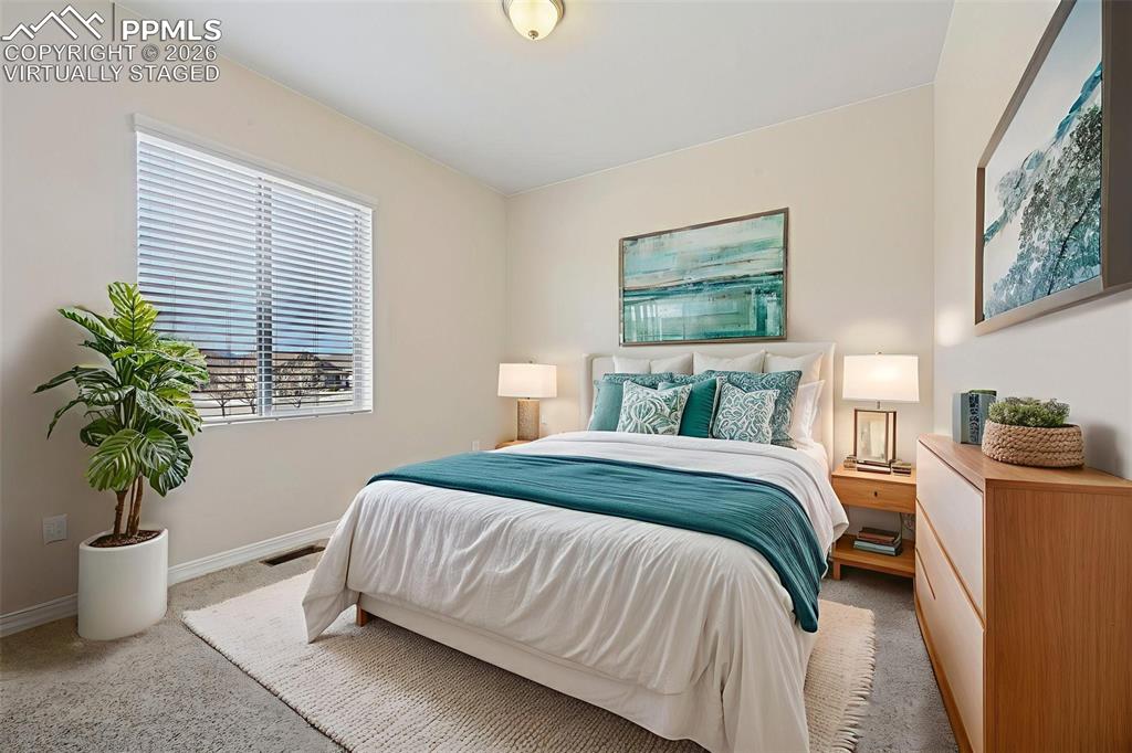 Image 29 of 41: Secondary bedroom - Virtually staged bedroom 3 at end of hallway - for conc