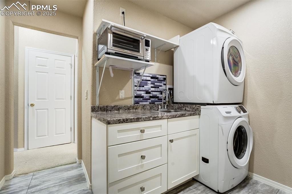 Image 44 of 50: Small kitchen laundry for rental purposes