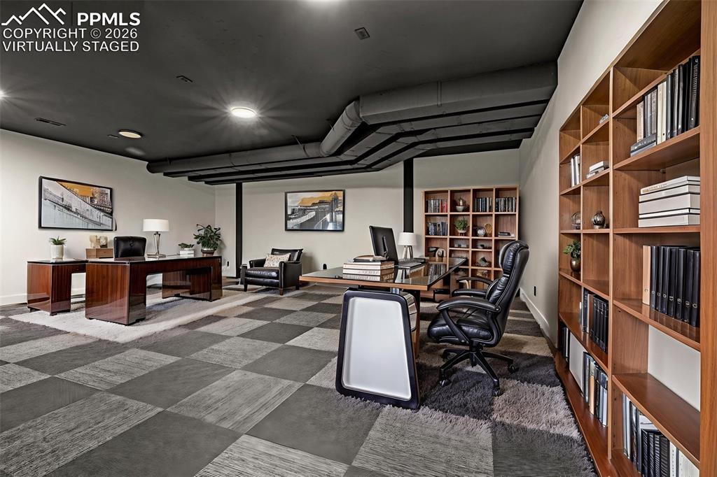 Image 15 of 50: Virtually staged as office, designed to be theatre. Lower level