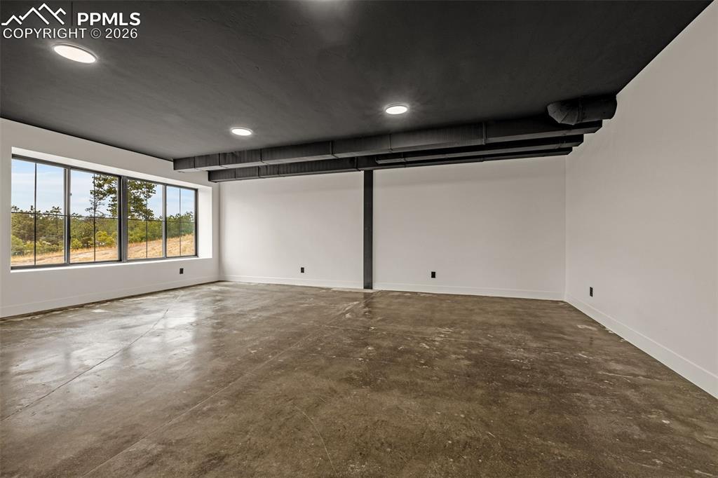 Image 18 of 50: Bedroom 1 In law suite with walk-in closet. Lower level.