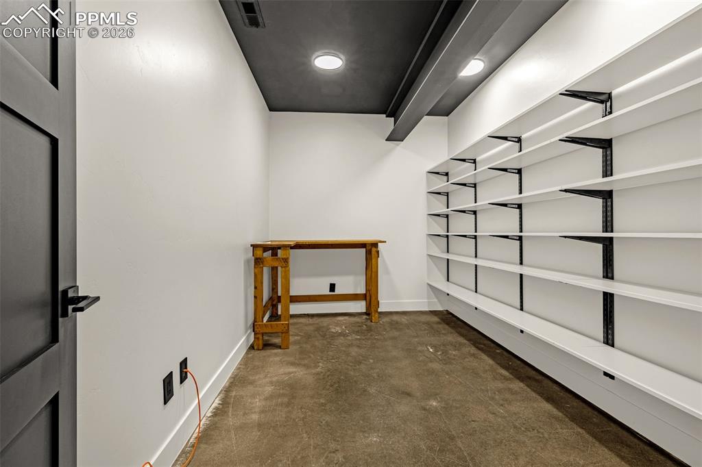 Image 19 of 50: Bedroom 1 walk-in closet. Lower level.