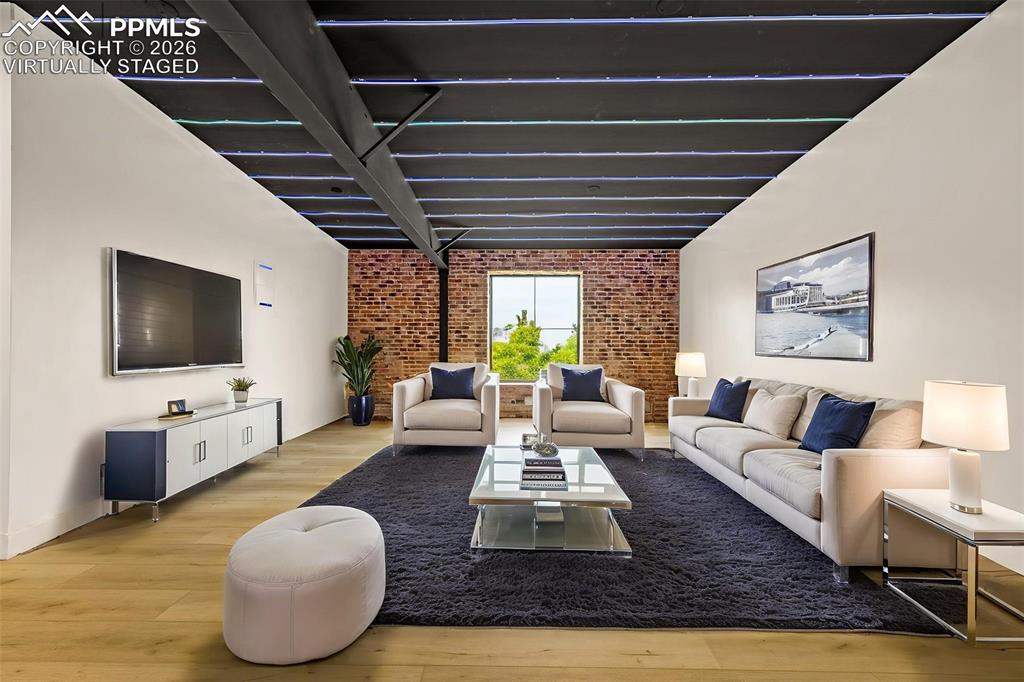 Image 20 of 50: Virtually staged. Open loft, entertainment media lounge or exercise area. U