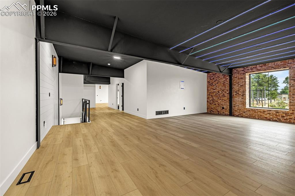 Image 22 of 50: Open loft, entertainment, media lounge or exercise area. Upper level.