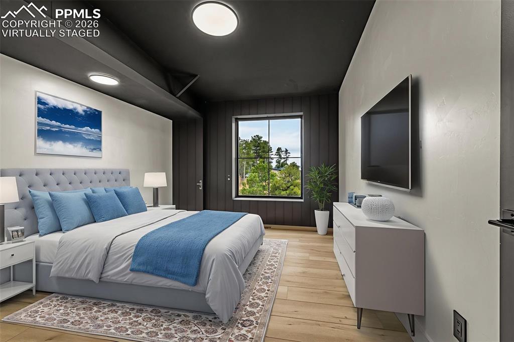 Image 30 of 50: Virtually staged - Bedroom 5, upper level.