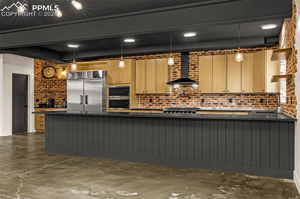 Image 4 of 50: Kitchen with walk-in pantry.