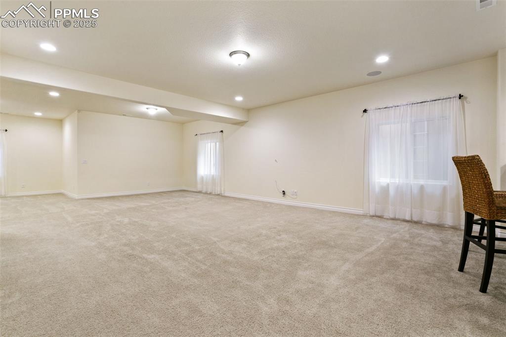 Image 31 of 49: Unfurnished room featuring light colored carpet and recessed lighting