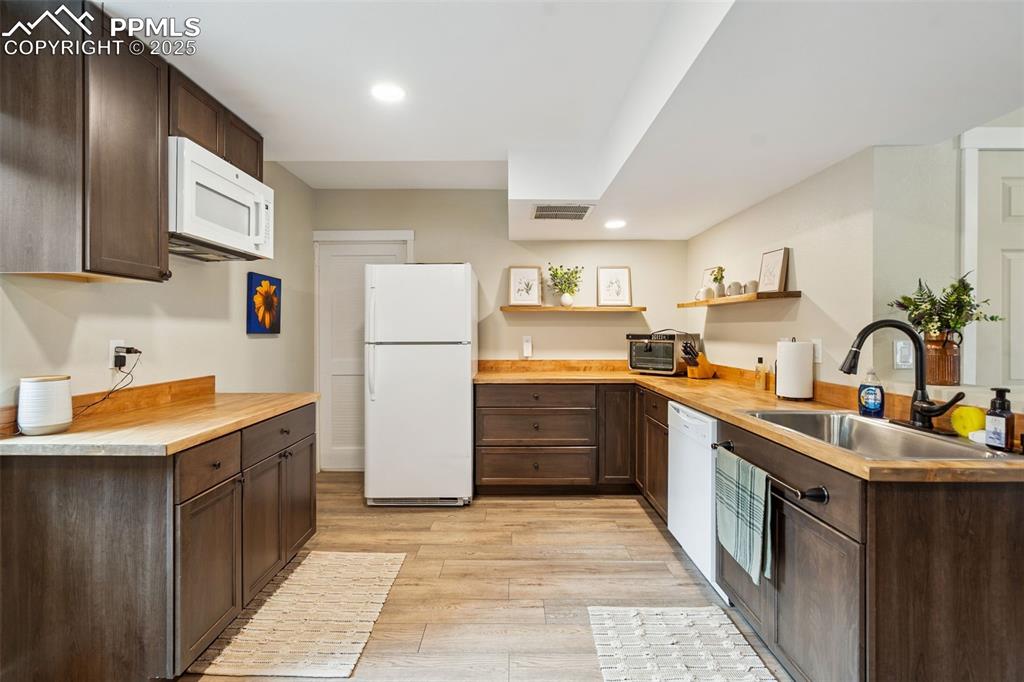 Image 40 of 49: Second kitchen in basement