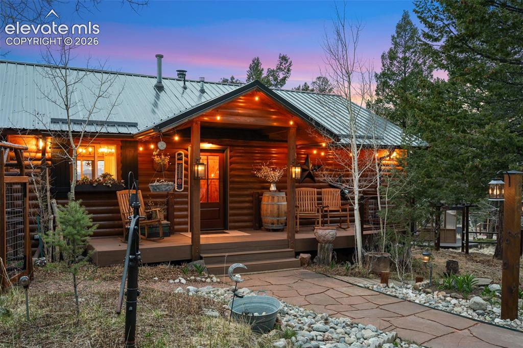 Image 1 of 34: Cozy and welcoming, the covered front porch offers the perfect spot to rela
