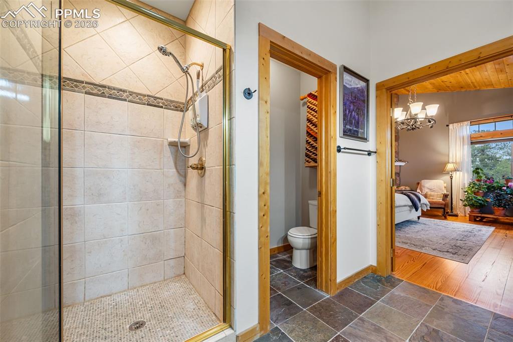 Image 13 of 34: Spacious and well designed, the primary suite bathroom includes a walk in s