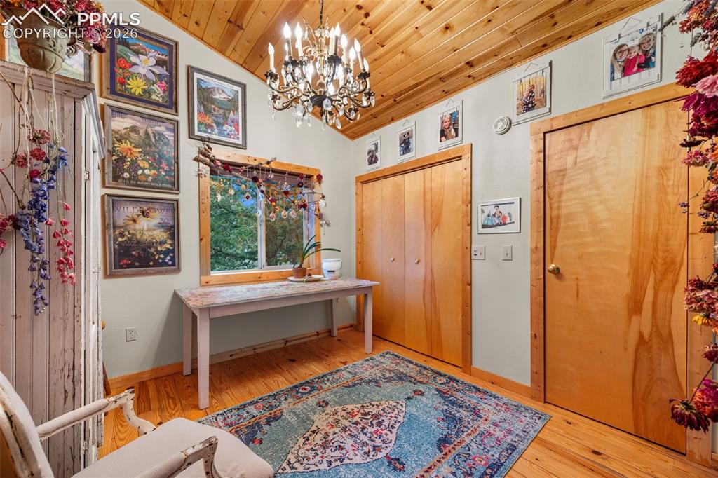 Image 14 of 34: Bright and versatile, this space features vaulted ceilings, warm wood accen