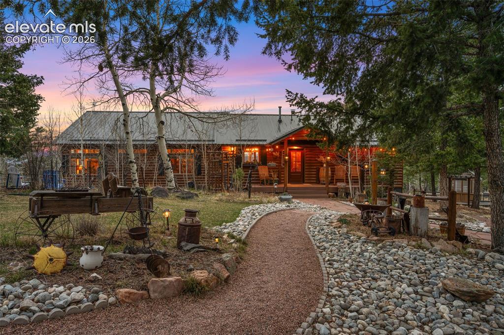 Image 2 of 34: Warm and inviting, this mountain home is nestled in the pines with a beauti