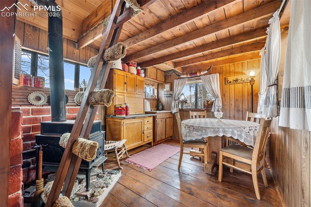 Image 22 of 34: Guest quarters kitchen, full of rustic charm, featuring warm wood finishes,