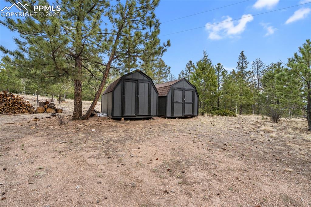 Image 30 of 34: Additional storage sheds provide convenient space for tools, equipment, or