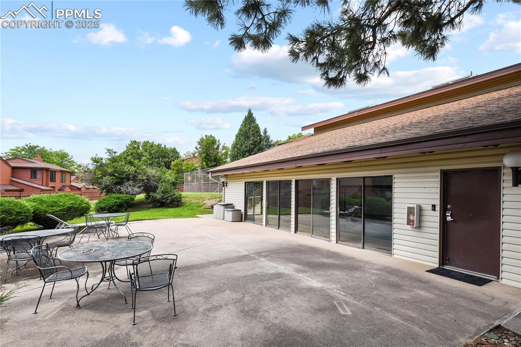 Image 38 of 39: View of clubhouse back patio