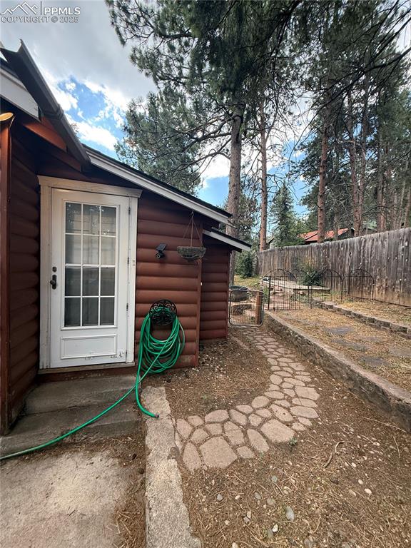 Image 15 of 23: View of property exterior with log veneer siding