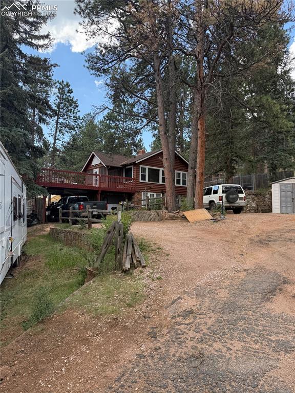 Image 3 of 23: Rustic home featuring a deck