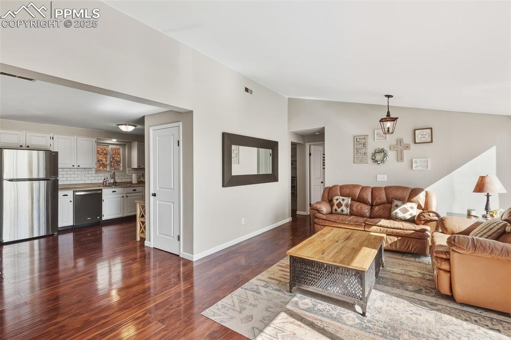 Image 10 of 33: Great room and kitchen