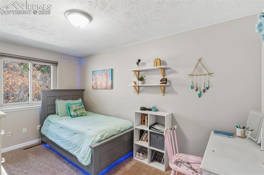 Image 16 of 33: Bedroom with views