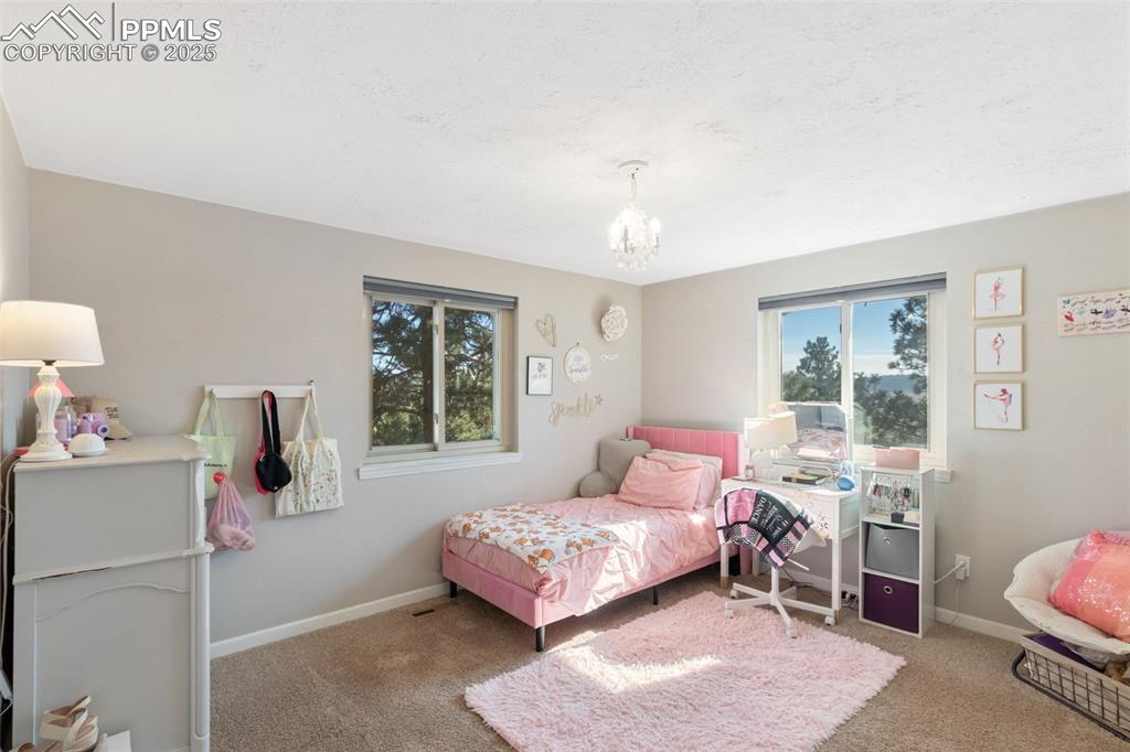 Image 17 of 33: Bedroom with views to mountains and pasture area