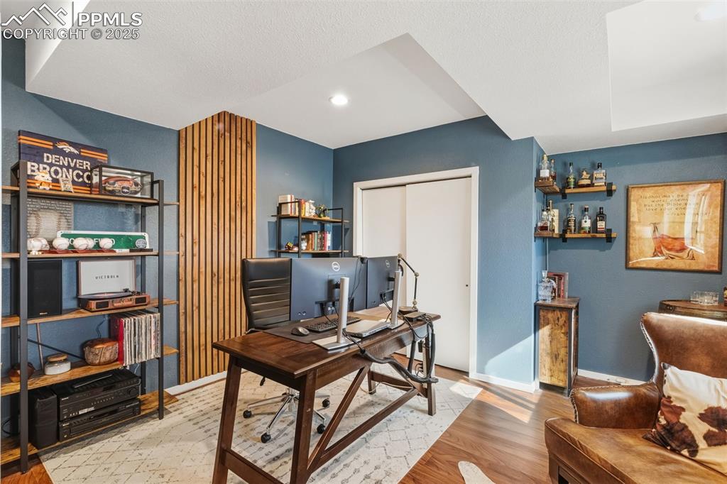 Image 18 of 33: Lower level office/bedroom facing views of the mountains