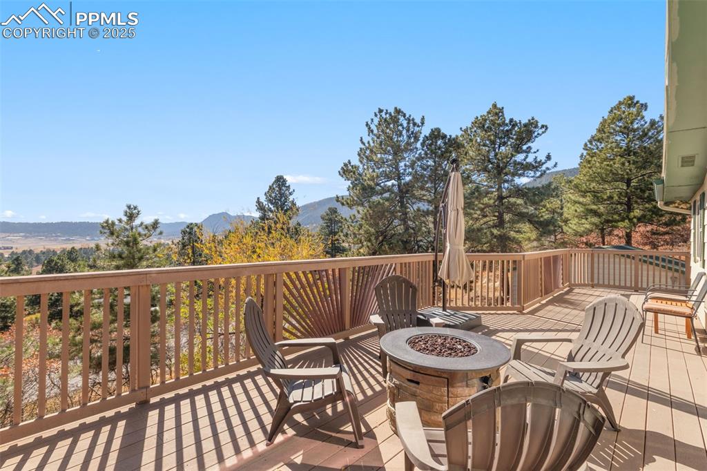 Image 3 of 33: Front deck with a mountain view 