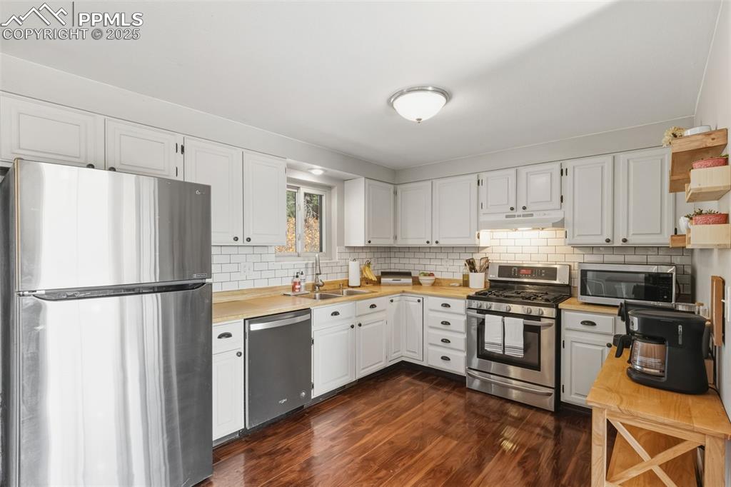 Image 8 of 33: Kitchen with stainless steel appliances