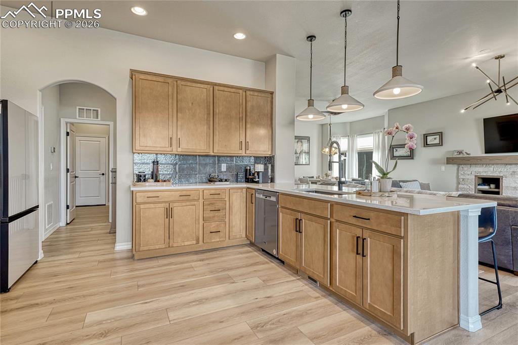 Image 13 of 50: View of garage door entry, through mudroom and right into kitchen. Function