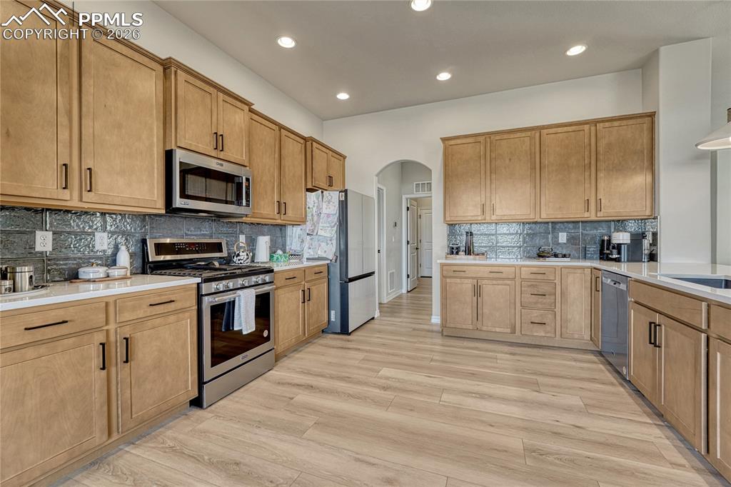 Image 14 of 50: Extra large kitchen, so much storage and designer tile backsplash