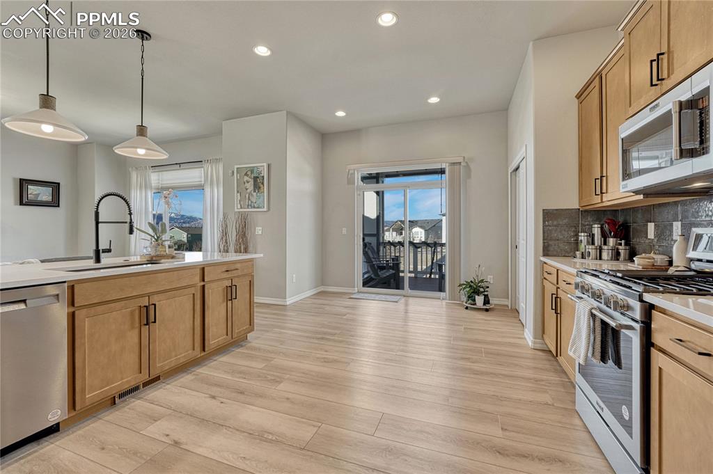 Image 15 of 50: View of walkout to patio from kitchen