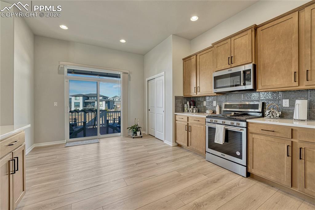 Image 17 of 50: Pantry space next to walk out sliders