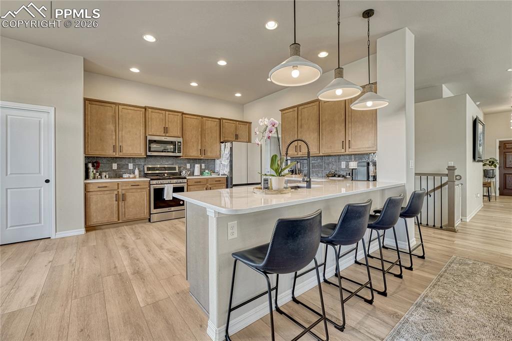 Image 2 of 50: Large kitchen with 42" cabinets and large breakfast bar