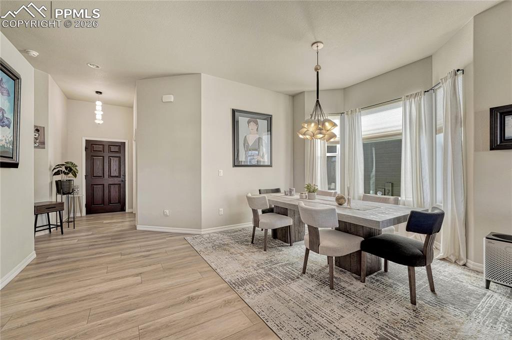 Image 3 of 50: large dining area, designer lighting