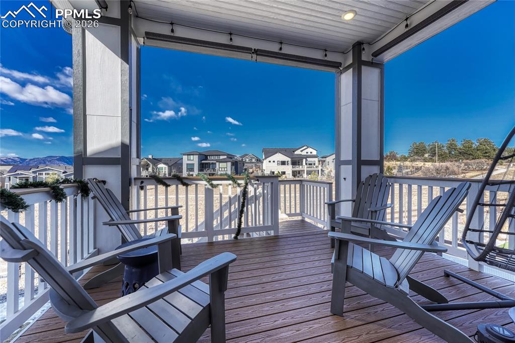 Image 41 of 50: Covered patio off of the kitchen with mountain views