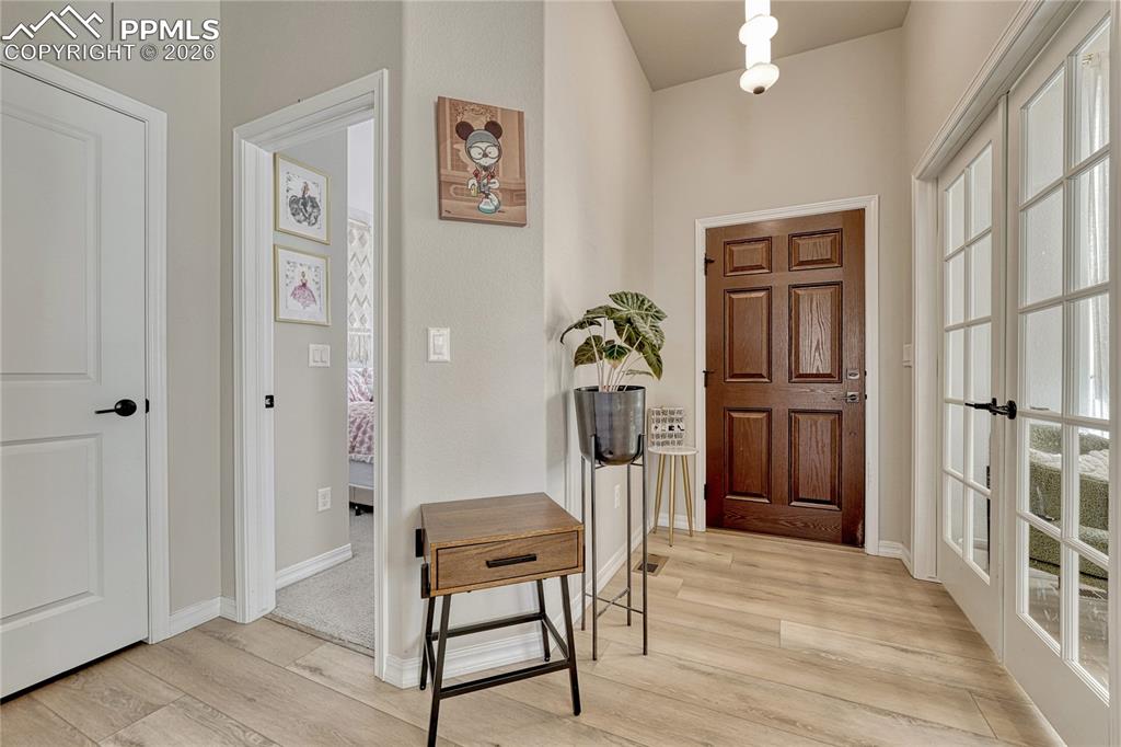 Image 8 of 50: Beautiful wide plank LVP throughout main level, carpet in bedrooms