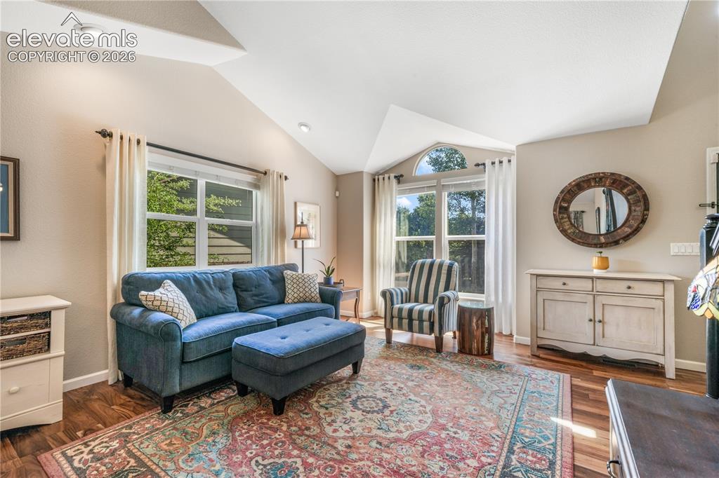 Image 10 of 50: View of entry way, front living room and access into dining