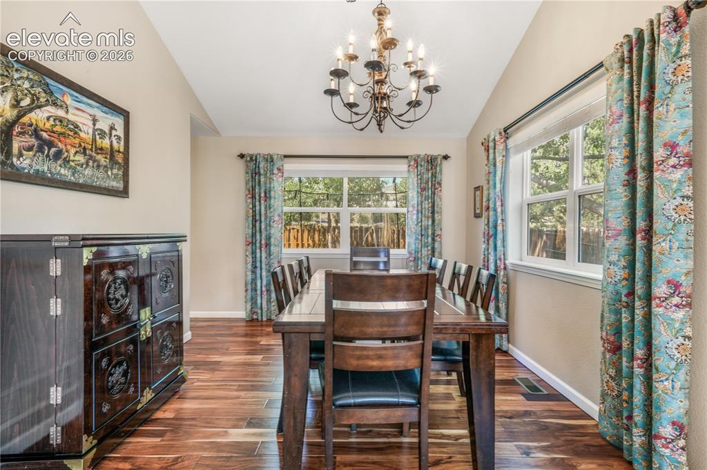 Image 11 of 50: View of entry way, front living room and access into dining
