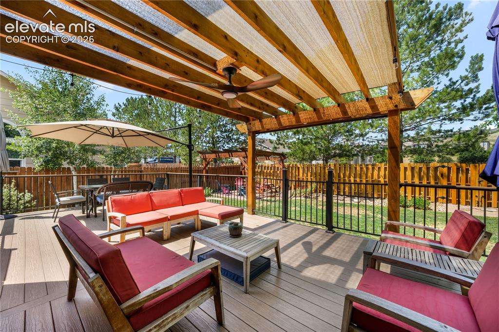 Image 20 of 50: Family room with gas fireplace and walk out access to the decks and backyar
