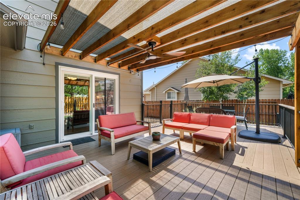Image 21 of 50: Family room with gas fireplace and walk out access to the decks and backyar