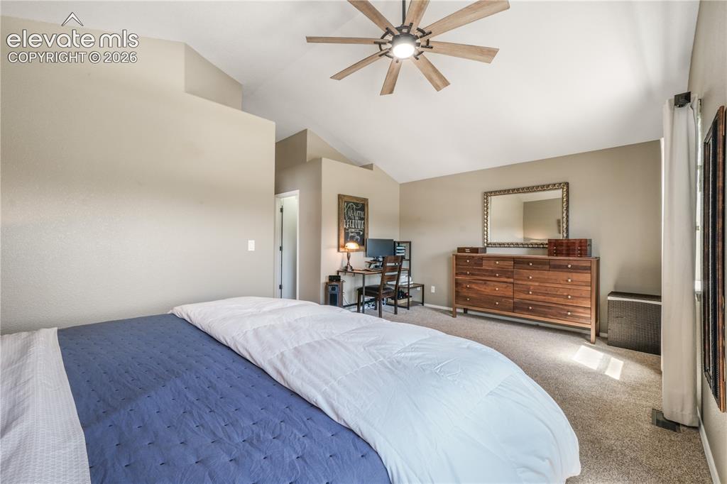 Image 28 of 50: Upstairs primary bedroom with large seating area, walk in closet and 5 piec