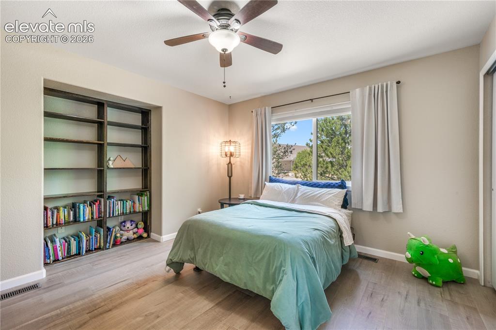 Image 31 of 50: Upstairs primary bedroom with large seating area, walk in closet and 5 piec