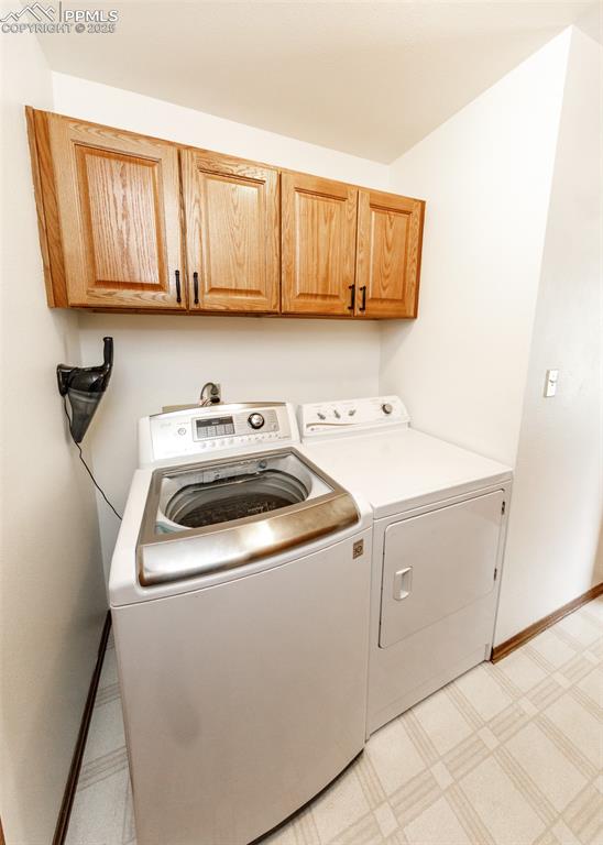 Image 24 of 44: Main level laundry with cabinets. Washer & Dryer are included