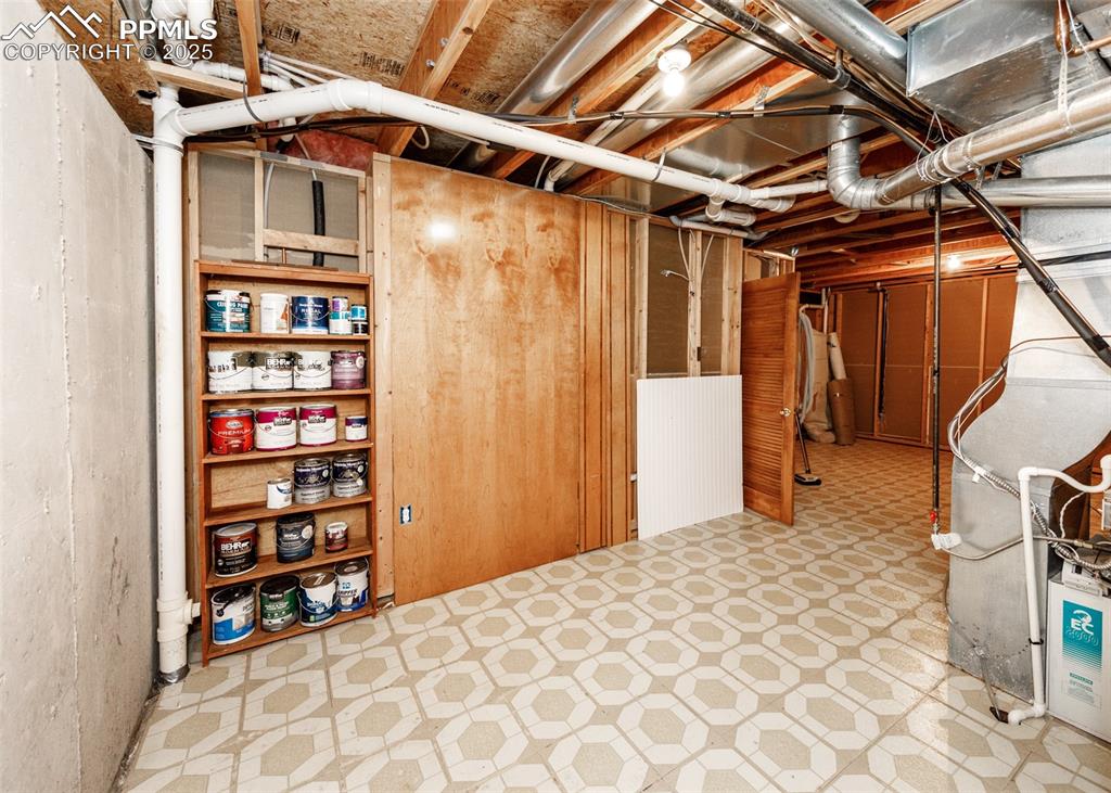 Image 32 of 44: Large lower level storage area. 