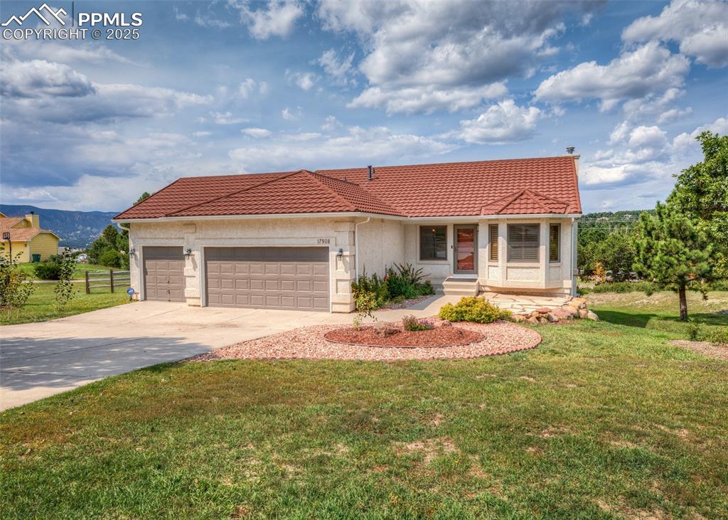 Image 35 of 44: Mediterranean / spanish-style house with a garage, concrete driveway, a til