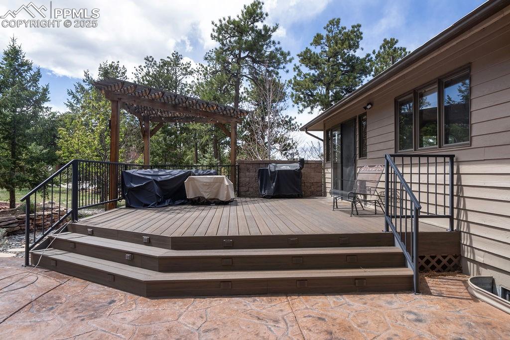 Image 39 of 42: Deck with a pergola