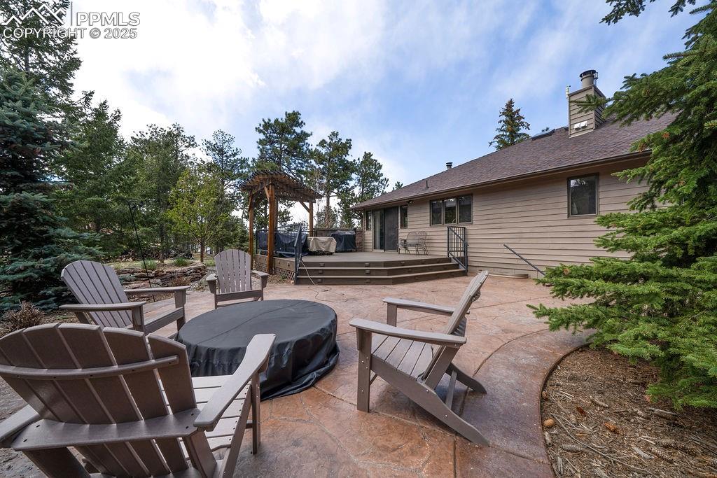 Image 40 of 42: View of patio featuring a wooden deck