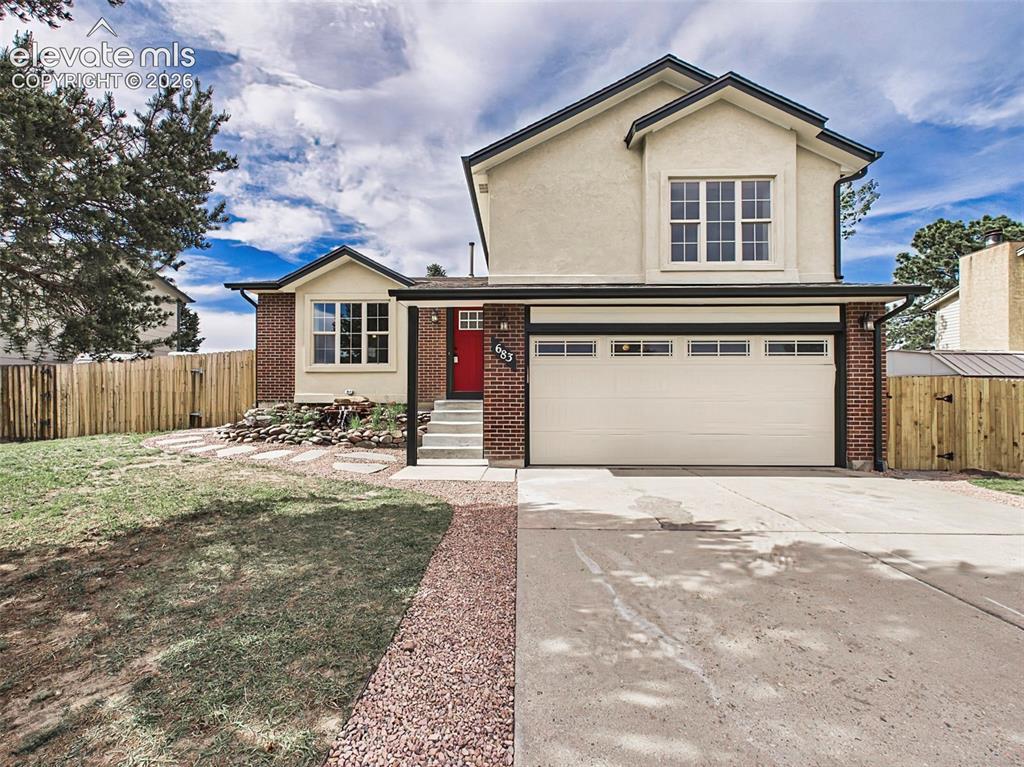 Image 1 of 50: Beautiful curb appeal with updated exterior finishes, mature landscaping, a