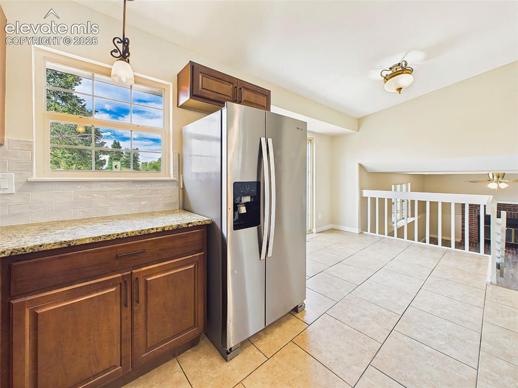 Image 17 of 50: Enjoy cooking in a bright and inviting kitchen complete with granite slab c